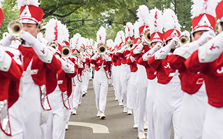 band members perform in a homecoming parade